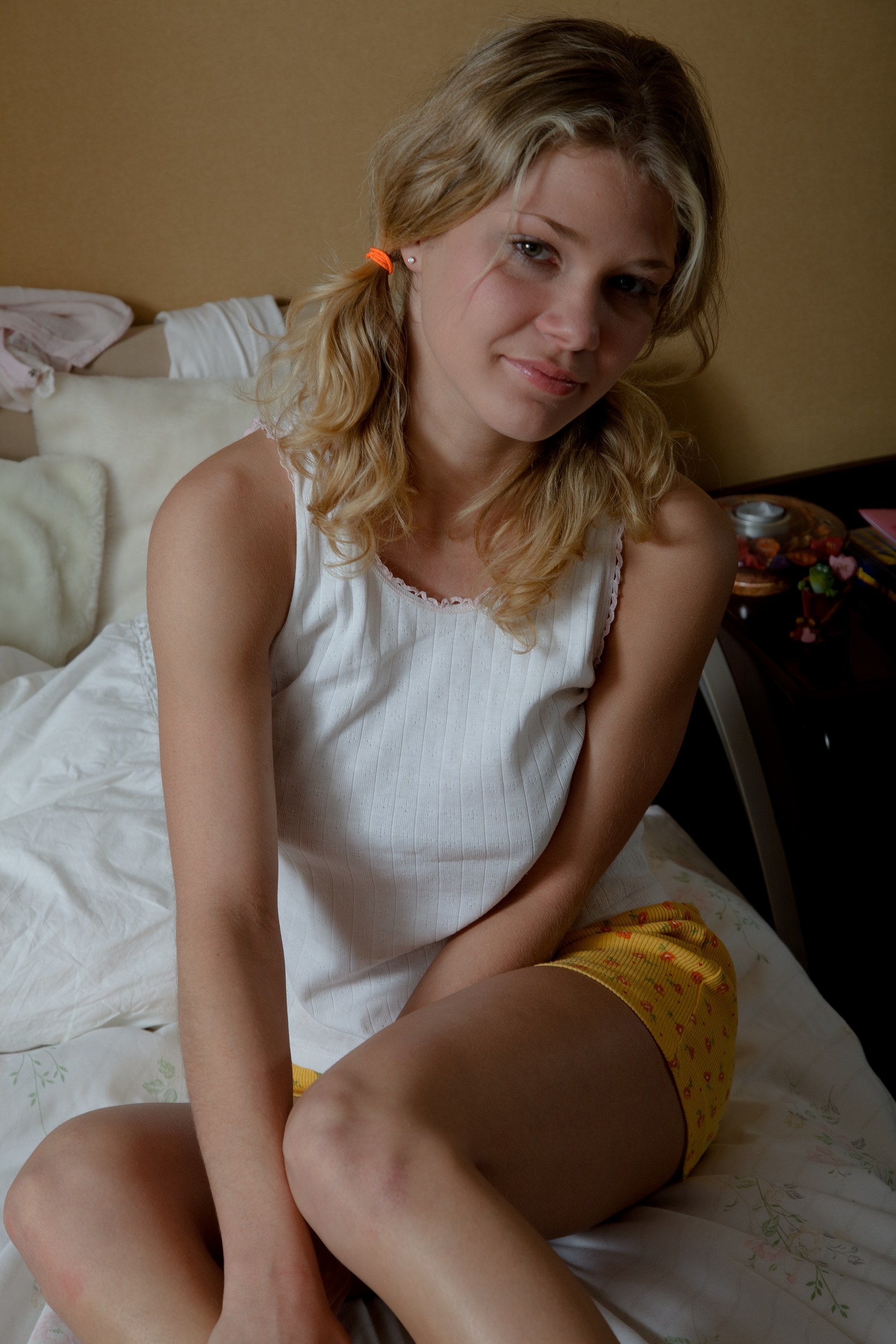 cute-blonde-teen-spreading-her-sweet-shaved-pussy-on-the-bed-4