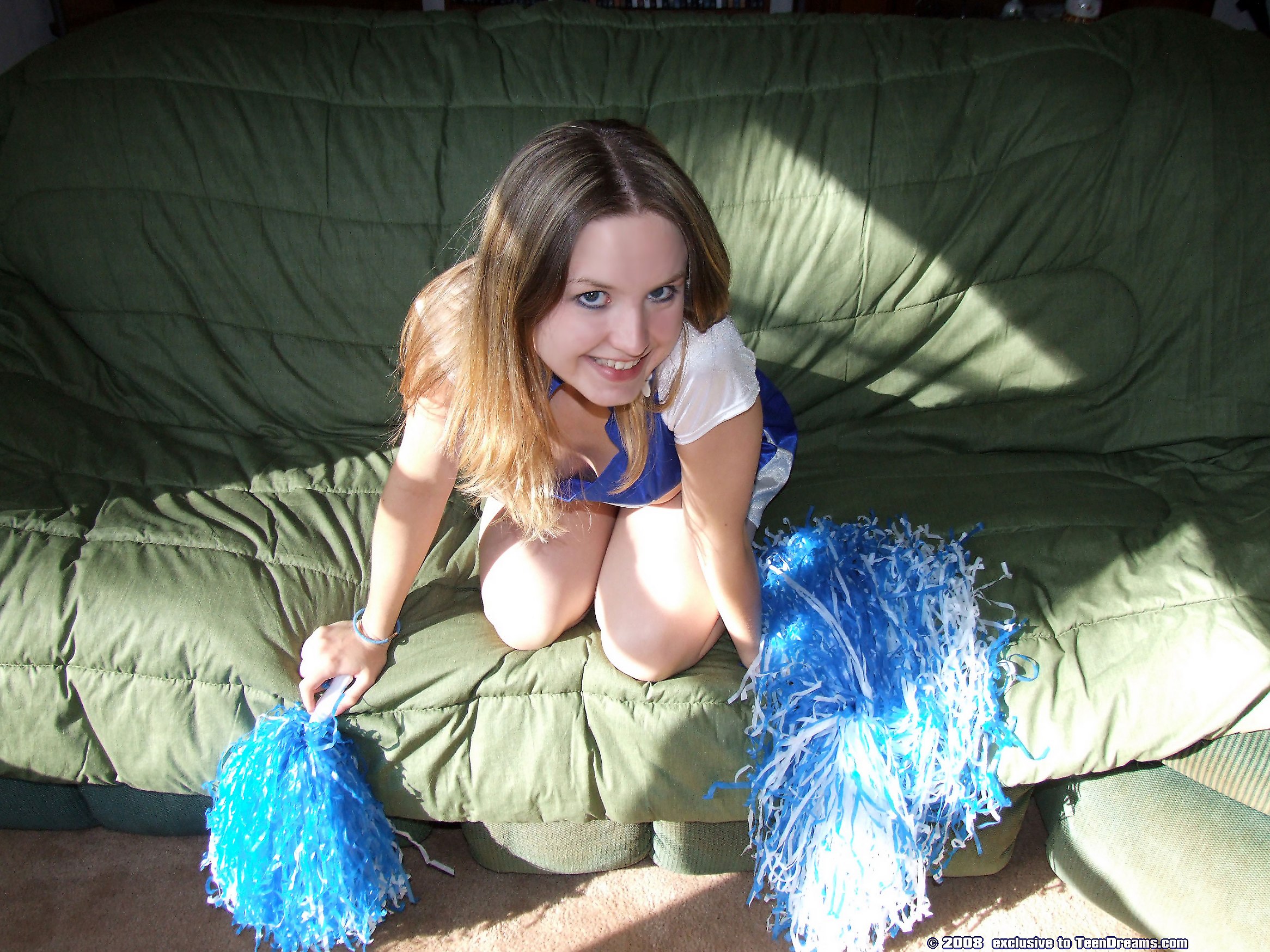 cute-cheer-leader-fingers-tasty-pussy-on-couch-4