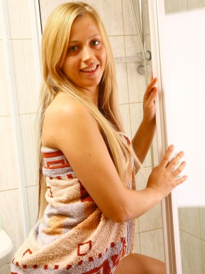 Hawt youthful golden-haired flashing leaking pussy in shower
